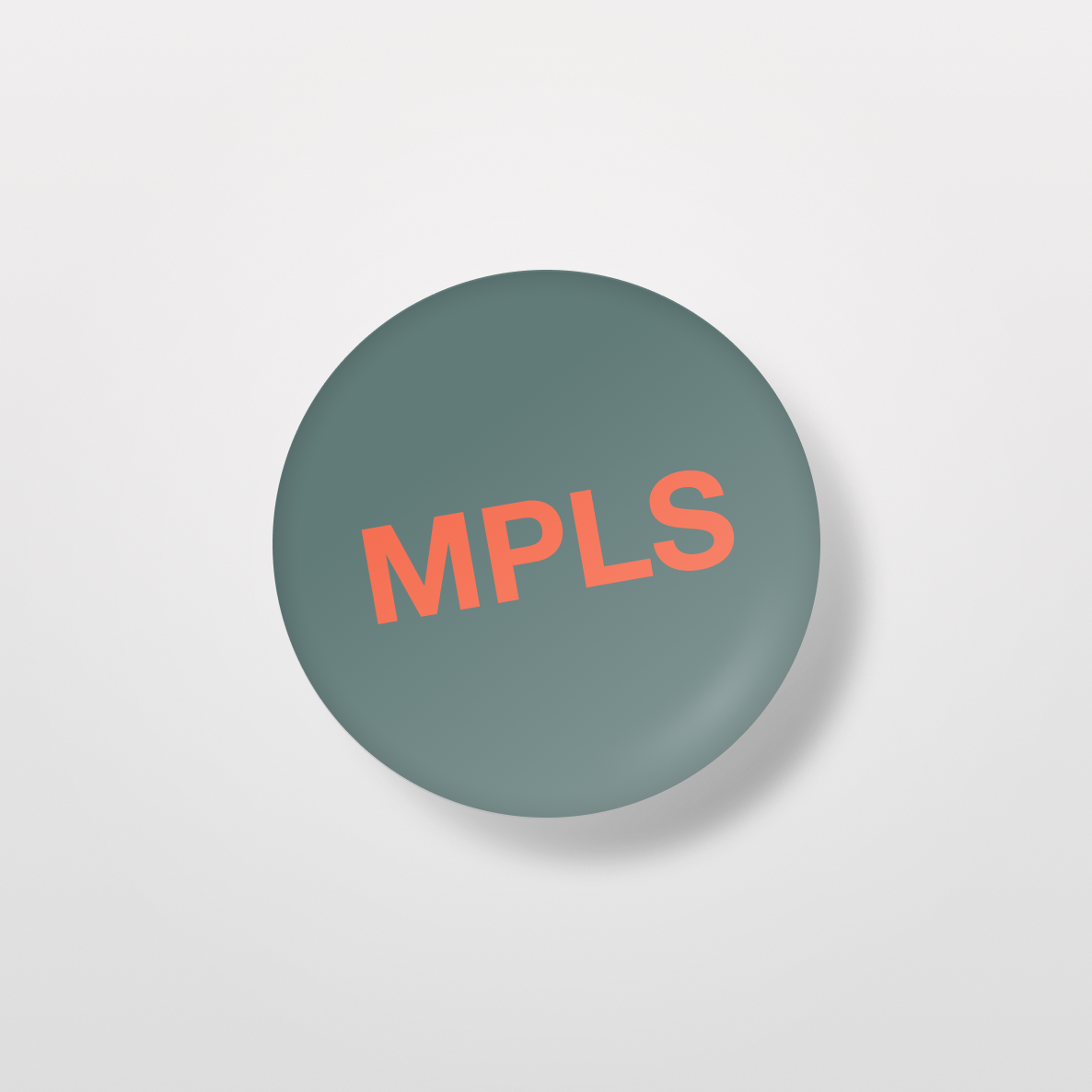 MPLS 1" Circle Pin: Teal and Orange